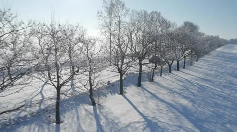 Aerial view of a car driving on the empty snowy road. Stock Footage 46814357