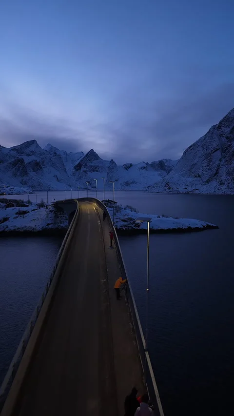 Aerial view of car driving over Hamnoy bridge at night in Lofoten islands Stock-Footage 346309495