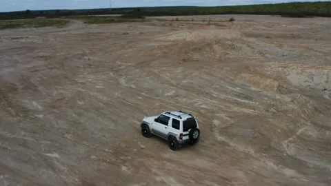 Aerial view of a car driving on sand Stock Footage 170440341
