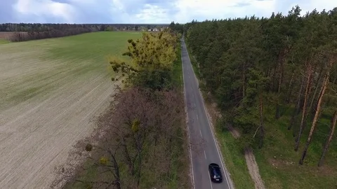 Aerial view of a car driving through scenic road. Video stock 78625771