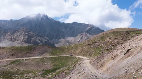 Aerial View Of Car Driving Through Tossor Pass In Kyrgyzstan - Drone Shot Видео 333150907