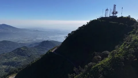 Aerial view of a car driving through a winding road on Mount Telomoyo, Central Vídeo Stock 347126979