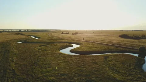 Aerial view the car is going at sunset along the road along the river Video stock 86006662