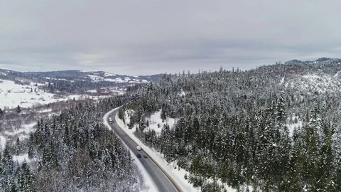 Aerial view of car on the mountain road, winter. Stock Footage 71831653