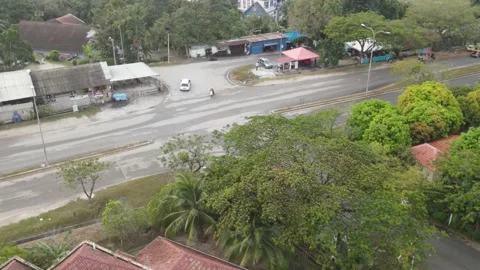 Aerial view of car moving out from residential area in Kajang Stock Footage 150749249