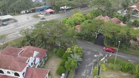 Aerial view of car moving on the road in residential area Kajang. Stock Footage 150749262