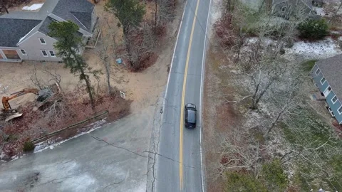 Aerial view of car moving on the road during Winter in Cape Cod, USA Stock Footage 232393002