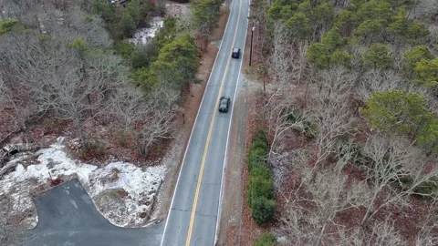 Aerial view of car moving on the road during Winter in Cape Cod, USA Stock Footage 232393022