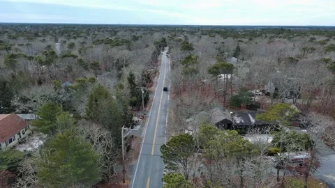 Aerial view of car moving on the road during Winter in Cape Cod, USA Stock Footage 232393047