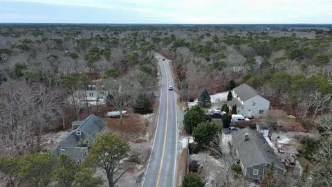 Aerial view of car moving on the road during Winter in Cape Cod, USA Stock Footage 232393098