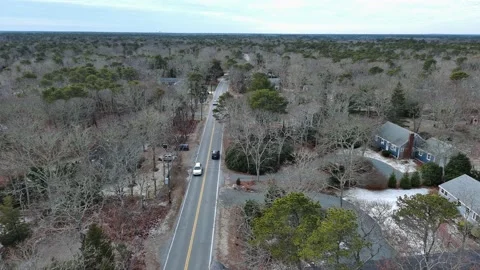 Aerial view of car moving on the road during Winter in Cape Cod, USA Stock Footage 232395959