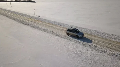 Aerial View Of Car Moving in winter snow road 스톡 동영상 101332444