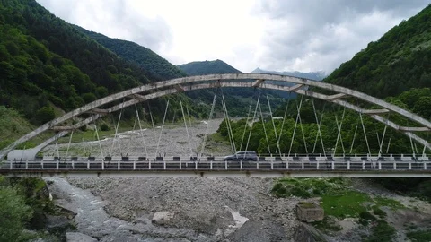 Aerial view. Car passes through the old concrete bridge. Stock-Footage 90972371