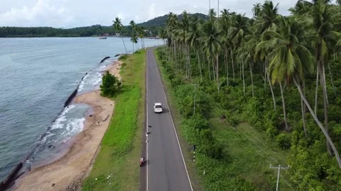 Aerial view of car passing through coast line of andaman and nicobar Stock Footage 234590507