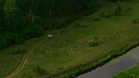 Aerial view of a car on the river bank Stock Footage 170911253