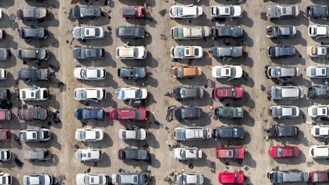 Aerial view of car scrap yard showing rows of abandoned accident vehicles f.. Video stock 326023607