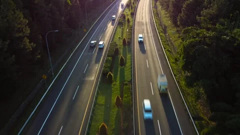 Aerial view of car traffic on highway at sunset. Stock Footage 269727678