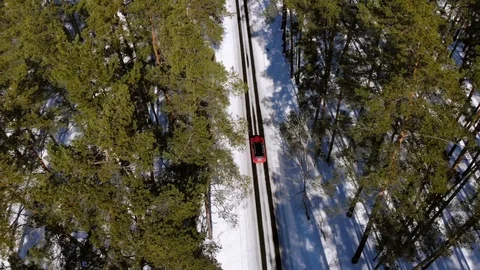 Aerial view of car trip through winter forest to holiday or vacation Stock Footage 88078559
