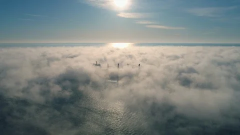 Aerial view of cargo container  ship sails in sea fog, crane vessel working f Stock Footage 121355419