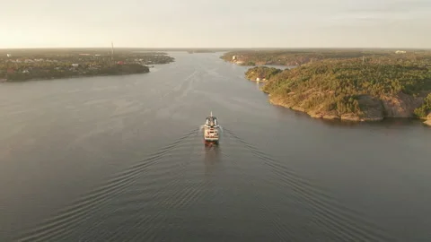 Aerial view of cargo container ship in the inlet to Stockholm city Stock Footage 136094305