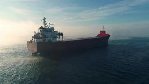 Aerial view of cargo container ship sails in sea fog Stock Footage 307260372