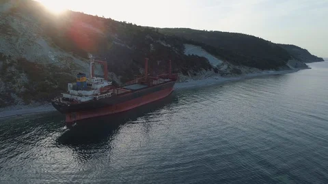 Aerial view cargo ship aground, stormy accident Stock Footage 126590844