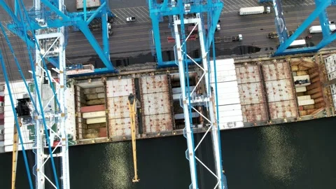 Aerial View of Cargo Ship Being Unloaded Stock Footage 154080454