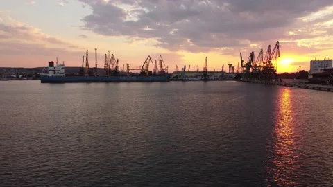 Aerial view of cargo ship bulk carrier is loaded with grain of wheat in port at Stock Footage 205074634