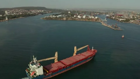 Aerial view of cargo ship calling at the port .  Stock Footage 154464884