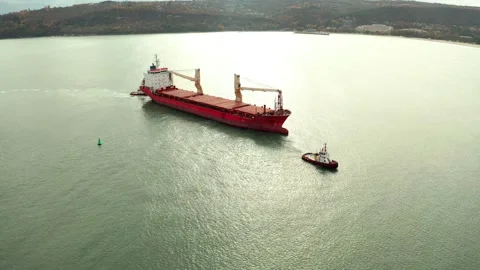 Aerial view of cargo ship calling at the port . Stock Footage 154465829