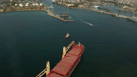 Aerial view of cargo ship calling at the port . Stock Footage 154466569