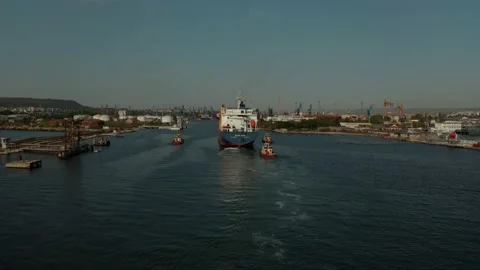 Aerial view of cargo ship calling at the port . Stock Footage 154466976
