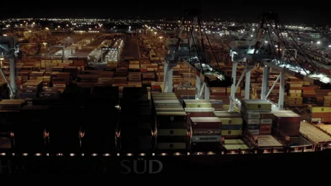 Aerial view of cargo ship with cargo containers stands on a berth in the port at Video stock 162886917