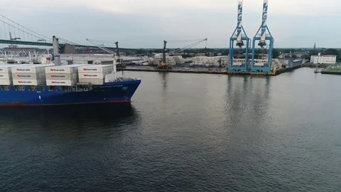 Aerial View of Cargo Ship Entering Port of Philadelphia and Parking Stock Footage 78331055