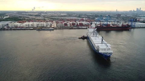 Aerial View of Cargo Ship Entering Port of Philadelphia and Parking Stock Footage 78331083