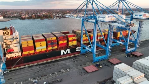 Aerial View of Cargo Ship Loading and Unloading Containers Video stock 222685830