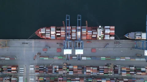 Aerial View of Cargo Ship Loading Containers at Industrial Port Terminal Stock Footage 330054571