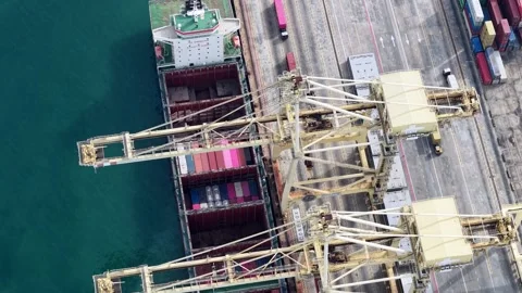 Aerial view of cargo ship loading at port 動画素材 338037939