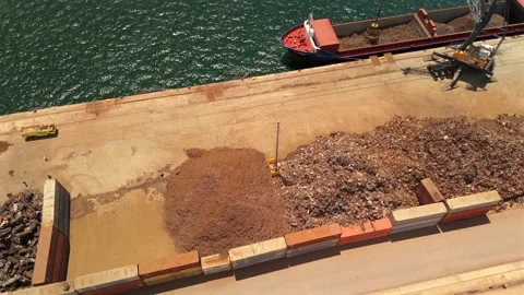 Aerial View Of Cargo Ship Loading At Quay With Scrap Metal Piles 動画素材 339031701