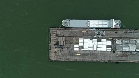 Aerial view of cargo ship loading blocks at a pier, Latvia. Stock Footage 340813325