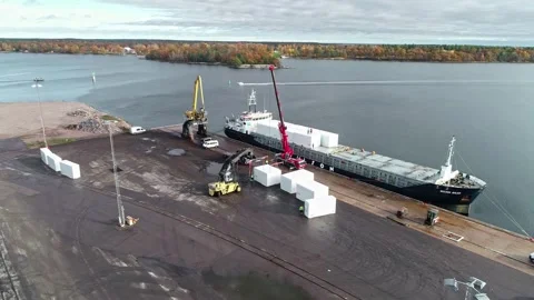 Aerial view of cargo ship loading containers at a port in Sweden. Stock Footage 340821045