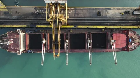Aerial view of cargo ship loading coal at port, Indonesia. Stock Footage 346659300