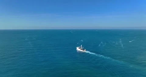 Aerial view of a cargo ship on the move in the middle of the sea Stock Footage 227922682