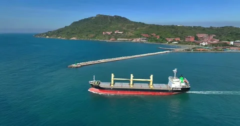 Aerial view of a cargo ship on the move in the middle of the sea Stock Footage 227924256