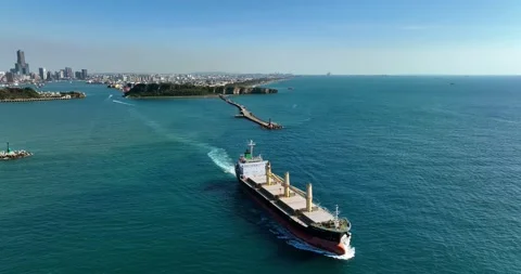 Aerial view of a cargo ship on the move in the middle of the sea Stock Footage 227924348