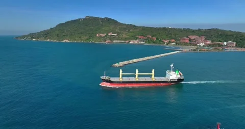 Aerial view of a cargo ship on the move in the middle of the sea Stock Footage 227924350
