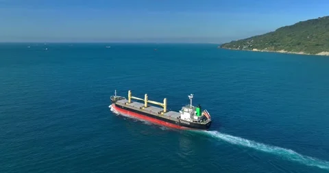 Aerial view of a cargo ship on the move in the middle of the sea Stock Footage 227924399