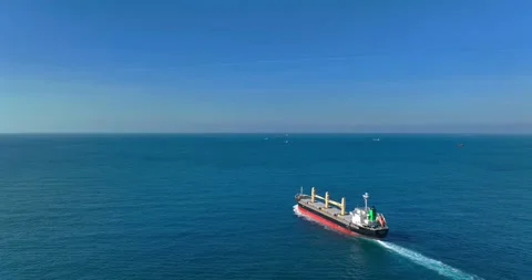 Aerial view of a cargo ship on the move in the middle of the sea Stock Footage 227924493