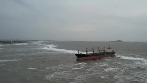 Aerial view of cargo ship moving across calm water in China Stock Footage 337759180
