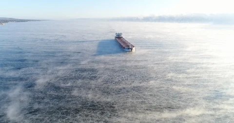 Aerial View of Cargo Ship Navigating on Lake Superior with Sea Smoke Stock Footage 99966246